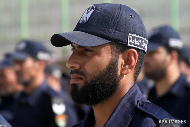 Palestinian Hamas officers and noncommissioned officers stand at attention to meet the new Director General of the Palestinian police Tayseer Al Batesh in Gaza city on June 7, 2011. Photo by Mohammed Asad
