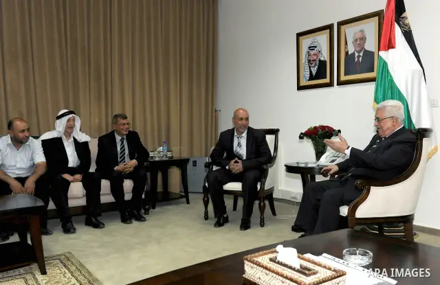 Palestinian President Mahmoud Abbas (Abu Mazen) meets with the liberated prisoner Fawaz Bakhtan in the west bank City of Ramallah on June 7, 2011. Photo by Thaer Ganaim