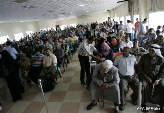 Palestinians wait to cross into Egypt through the Rafah border crossing in the southern Gaza Strip on June 8, 2011 after it was reopened, ending a four-day closure amid disagreements between Egyptian and Hamas officials....