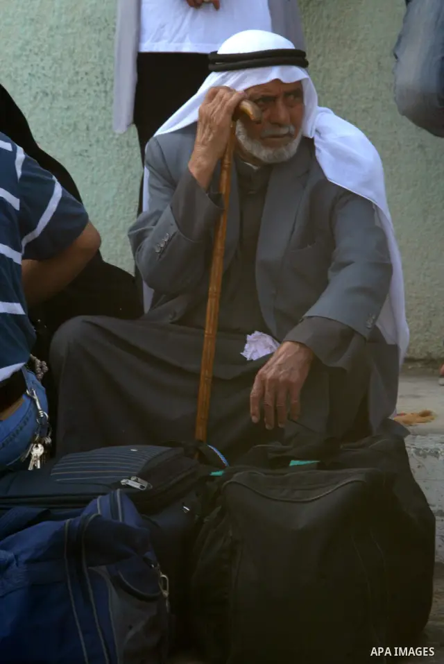 A Palestinian man waits to cross into Egypt through the Rafah border crossing in the southern Gaza Strip on June 8, 2011 after it was reopened, ending a four-day closure amid disagreements between Egyptian and Hamas offi...