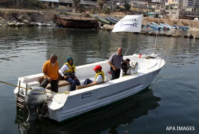 Foreign activists ride their Oliva boat to monitor the violations of the Israeli forces against the Palestinian fishermen in the Mediterranean Sea off the coast of Gaza City on June 8,2011.. Photo by Mohammed Asad