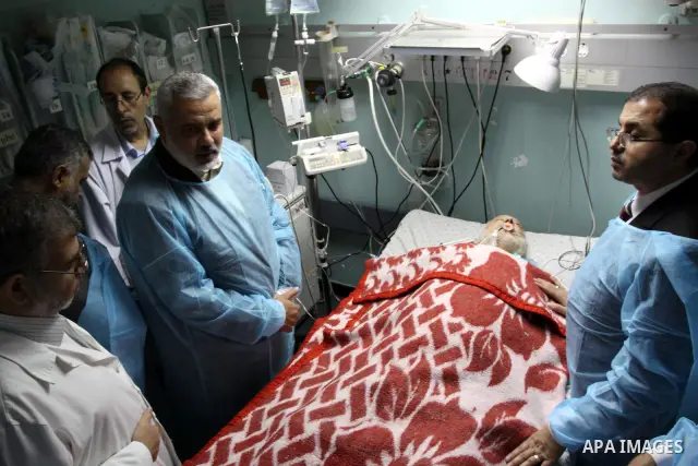 Palestinian Prime Minister in Gaza Strip, Ismail Haniya visits Mohammed Shamaa, one of the founders of Hamas Movement, at Al-Shefa Hospital in Gaza City on June 8,2011. Photo by Mohammed Asad