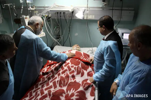Palestinian Prime Minister in Gaza Strip, Ismail Haniya visits Mohammed Shamaa, one of the founders of Hamas Movement, at Al-Shefa Hospital in Gaza City on June 8,2011. Photo by Mohammed Asad
