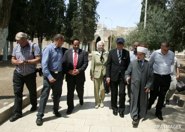 Palestinian Grand Mufti, Mohammed Hussein with the former Prime Minister of Norway and his wife tour inside Al-Aqsa mosque compound during their visit to Jerusalem's old city on June 9,2011. Photo by Mahfouz Abu Turk