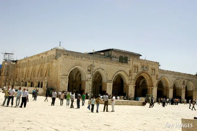 Palestinian Muslim worshipers walk in front of the Al-Aqsa mosque after Friday prayer at the Al-Aqsa mosque compound in Jerusalem's Old City on June 10, 2011. Photo by Mahfouz Abu Turk
