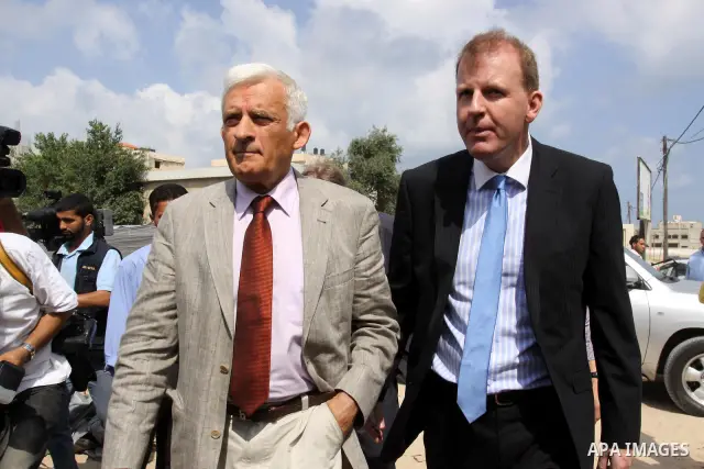 European Parliament President Jerzy Buzek (C) visits a UN aid center in al-Shati refugee camp in Gaza City on June 13, 2011. Photo by Mohammed Asad