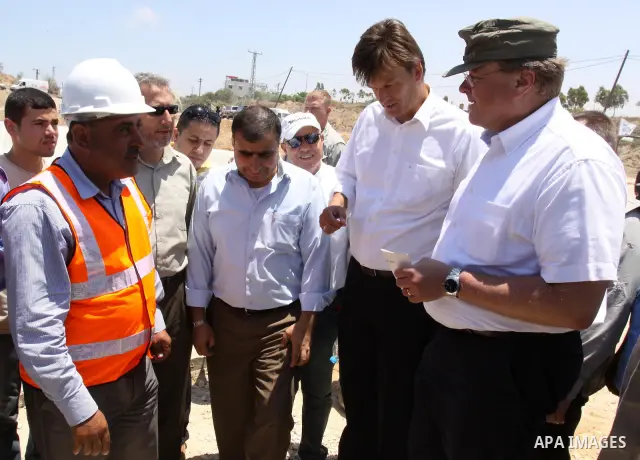 German Development Minister, Dirk Nebel speaks with labourers working in Gaza water treatment plant in Gaza city on June 14,2011. Photo by Mohammed Asad