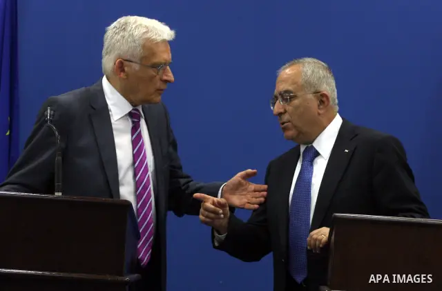 European Parliament President Jerzy Buzek speaks with Palestinian Prime Minister Salam Fayyad during a joint press conference in the West Bank city of Ramallah on June 14, 2011. Photo by Issam Rimawi