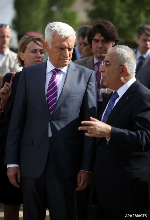 European Parliament President Jerzy Buzek speaks with Palestinian Prime Minister Salam Fayyad during their meeting in the West Bank city of Ramallah on June 14, 2011. Photo by Issam Rimawi