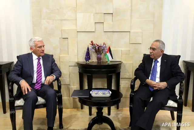 European Parliament President Jerzy Buzek speaks with Palestinian Prime Minister Salam Fayyad during their meeting in the West Bank city of Ramallah on June 14, 2011. Photo by Mustafa Abu Dayeh