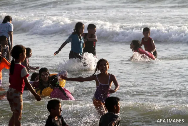 Palestinians enjoy swimming at the beach in Gaza city on June 14, 2011. Photo by Mohammed Asad