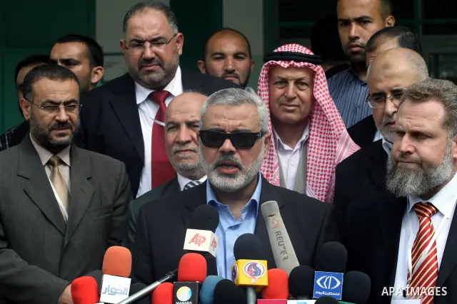 Palestinian Prime Minister in Gaza Strip, Ismail Haniya visits students as they sit for their final high school exams, known as "Tawjihi", in Gaza City on June 15, 2011. Photo by Mohammed Asad