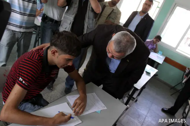 Palestinian Prime Minister in Gaza Strip, Ismail Haniya visits students as they sit for their final high school exams, known as "Tawjihi", in Gaza City on June 15, 2011. Photo by Mohammed Asad