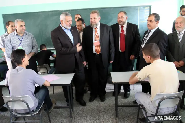 Palestinian Prime Minister in Gaza Strip, Ismail Haniya visits students as they sit for their final high school exams, known as "Tawjihi", in Gaza City on June 15, 2011. Photo by Mohammed Asad