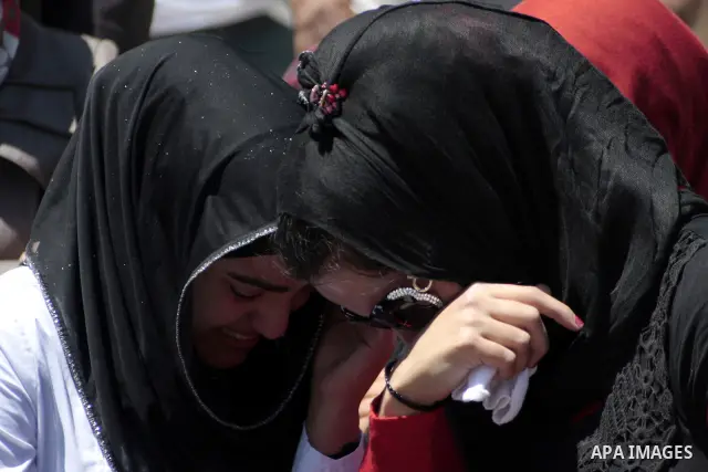 Palestinian girls cry during a protest calling for the release of prisoners from Israeli jails, outside the Red Cross offices in the West Bank city of Hebron on June 15, 2011. Photo by Najeh Hashlamoun