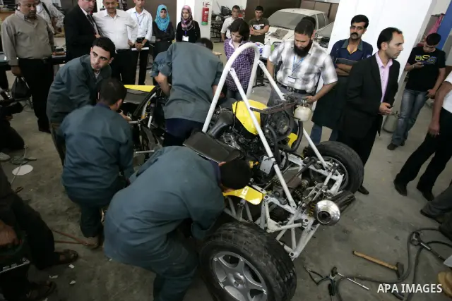 Palestinian students test their Formula 1-style racing car, made from scratch out of recycled parts, they have produced at their technical college run by the United Nations in Khan Yunis, southern Gaza Strip, on June 15,...