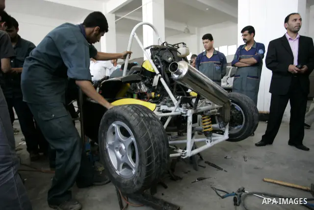 Palestinian students test their Formula 1-style racing car, made from scratch out of recycled parts, they have produced at their technical college run by the United Nations in Khan Yunis, southern Gaza Strip, on June 15,...