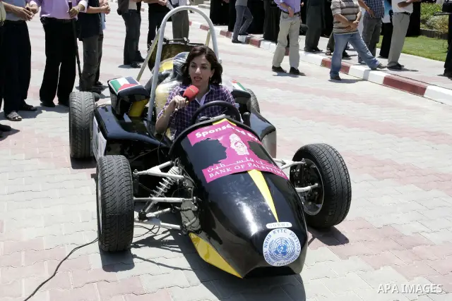 Palestinian students test their Formula 1-style racing car, made from scratch out of recycled parts, they have produced at their technical college run by the United Nations in Khan Yunis, southern Gaza Strip, on June 15,...