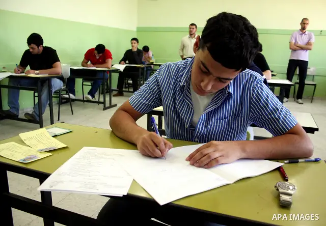 Palestinian students sit for their final high school exams, known as "Tawjihi", in the West Bank city of Ramallah on June 14, 2011. Photo by Issam Rimawi