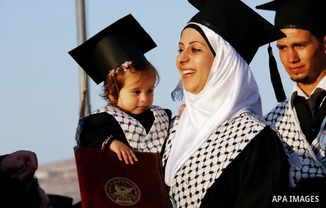 Palestinian students attend a graduation ceremony at the An Najah University in the West Bank city of Nablus ,Wednesday, June 15, 2011. Photo by Wagdi Eshtayah ..