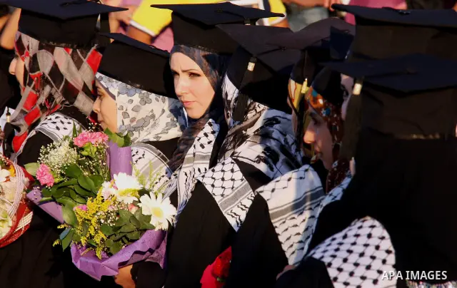 Palestinian students attend a graduation ceremony at the An Najah University in the West Bank city of Nablus ,Wednesday, June 15, 2011. Photo by Wagdi Eshtayah ..