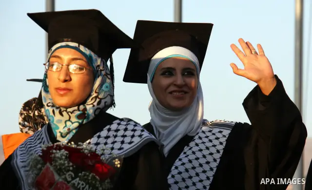 Palestinian students attend a graduation ceremony at the An Najah University in the West Bank city of Nablus ,Wednesday, June 15, 2011. Photo by Wagdi Eshtayah ..