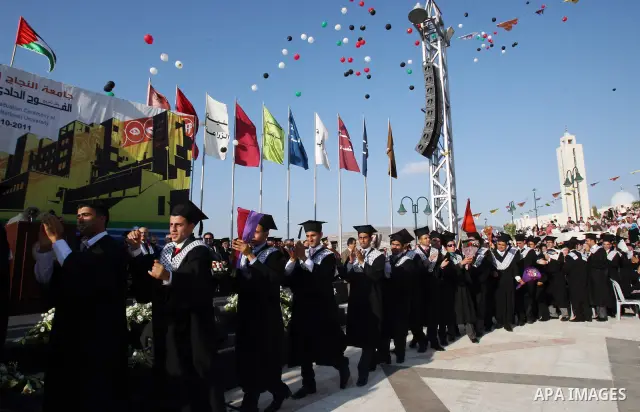 Palestinian students attend a graduation ceremony at the An Najah University in the West Bank city of Nablus ,Wednesday, June 15, 2011. Photo by Wagdi Eshtayah ..