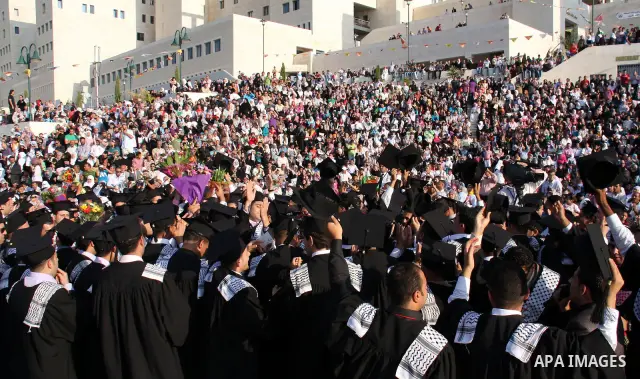 Palestinian students attend a graduation ceremony at the An Najah University in the West Bank city of Nablus ,Wednesday, June 15, 2011. Photo by Wagdi Eshtayah ..