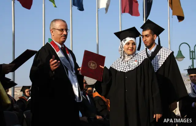 Palestinian students attend a graduation ceremony at the An Najah University in the West Bank city of Nablus ,Wednesday, June 15, 2011. Photo by Wagdi Eshtayah ..