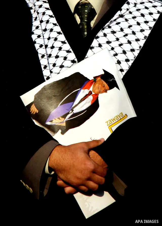Palestinian students attend a graduation ceremony at the An Najah University in the West Bank city of Nablus ,Wednesday, June 15, 2011. Photo by Wagdi Eshtayah ..
