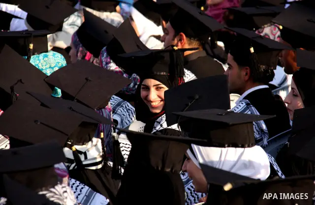 Palestinian students attend a graduation ceremony at the An Najah University in the West Bank city of Nablus ,Wednesday, June 15, 2011. Photo by Wagdi Eshtayah ..