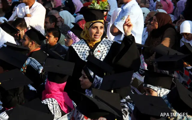 Palestinian students attend a graduation ceremony at the An Najah University in the West Bank city of Nablus ,Wednesday, June 15, 2011. Photo by Wagdi Eshtayah ..