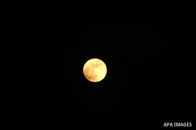 A Portion of the moon crosses into the Earth's shadow seen from Gaza city, on June 15, 2011. Astronomers in parts of Europe, Africa, Central Asia and Australia were hoping for clear skies on June 15 to enjoy a total luna...