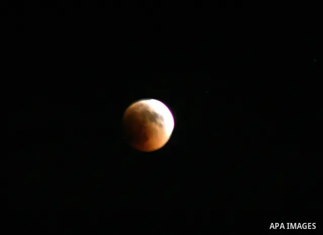 A Portion of the moon crosses into the Earth's shadow seen from Jerusalem City, on June 15, 2011. Astronomers in parts of Europe, Africa, Central Asia and Australia were hoping for clear skies on June 15 to enjoy a total...