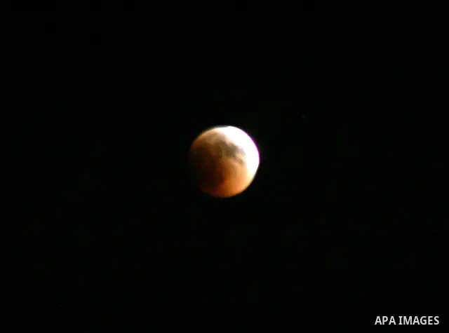 A Portion of the moon crosses into the Earth's shadow seen from Jerusalem City, on June 15, 2011. Astronomers in parts of Europe, Africa, Central Asia and Australia were hoping for clear skies on June 15 to enjoy a total...