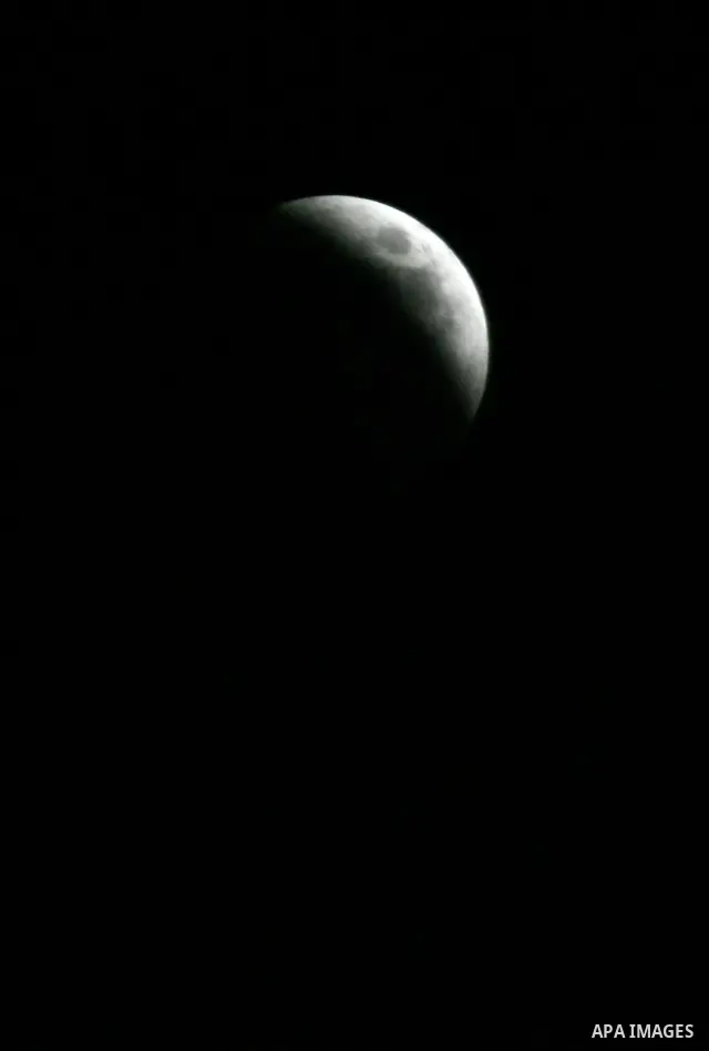 A Portion of the moon crosses into the Earth's shadow seen from Gaza Strip, Rafah City, on June 15, 2011. Astronomers in parts of Europe, Africa, Central Asia and Australia were hoping for clear skies on June 15 to enjoy...