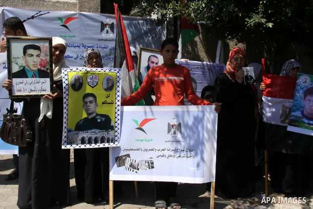 Palestinian jailed relatives take part in a protest calling for the release of Palestinian and Egyptian prisoners from the Israeli jails in front of the Egyptian Embassy in Gaza City on June 16, 2011. Photo by Mohammed A...