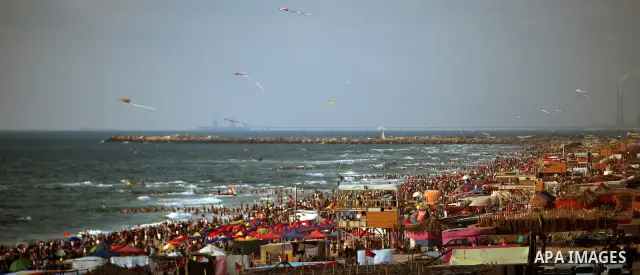 Palestinians on a beach in the west of Gaza City 17 June 2011. Reports state that during the summer the beach is a major venue for entertainment and leisure in the Gaza Strip. Photo by Ali Jadallah