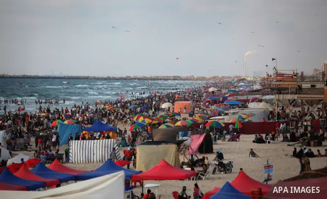 Palestinians on a beach in the west of Gaza City 17 June 2011. Reports state that during the summer the beach is a major venue for entertainment and leisure in the Gaza Strip. Photo by Ali Jadallah