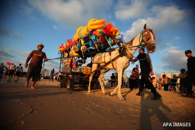 A Palestinian vendor on a beach in the west of Gaza City 17 June 2011. Reports state that during the summer the beach is a major venue for entertainment and leisure in the Gaza Strip. Photo by Ali Jadallah