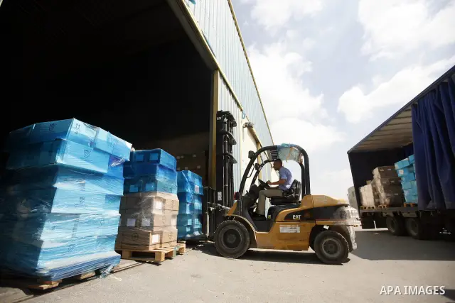 Palestinian Ministry of Health during moving convoy of twenty trucks carrying medicine to Gaza Strip from the west bank city of Nablus on June 18, 2011. Photo by Wagdi Eshtayah . ..