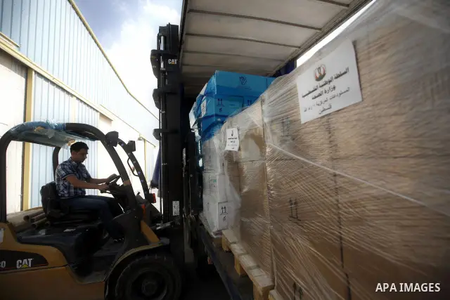 Palestinian Ministry of Health during moving convoy of twenty trucks carrying medicine to Gaza Strip from the west bank city of Nablus on June 18, 2011. Photo by Wagdi Eshtayah . ..