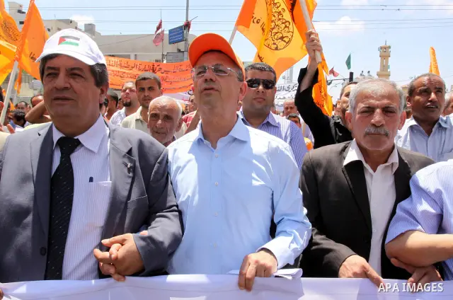 The head of Palestinian National Initiative movement, Mustafa al-Barghuti participates in a rally to mark the ninth anniversary of the movement foundation in Gaza city on Jun 18,2011. Photo by Mohammed Asad