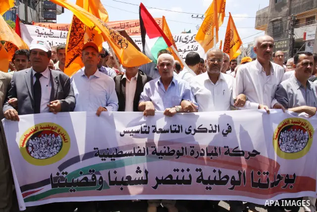 The head of Palestinian National Initiative movement, Mustafa al-Barghuti participates in a rally to mark the ninth anniversary of the movement foundation in Gaza city on Jun 18,2011. Photo by Mohammed Asad