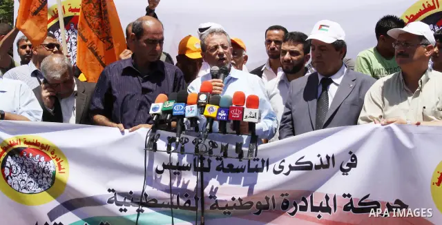The head of Palestinian National Initiative movement, Mustafa al-Barghuti delivers speech during a rally to mark the ninth anniversary of the movement foundation in Gaza city on Jun 18,2011. Photo by Mohammed Asad