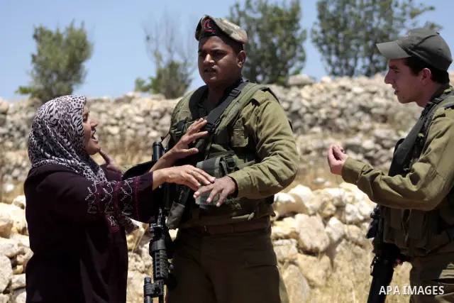 Israeli soldiers scuffle with protesters on Jun 18, 2011 during a demonstration by foreign, Israeli and Palestinian activists against the Jewish settlement of Karmei Tzur near the Palestinian village of Beit Omar, just n...