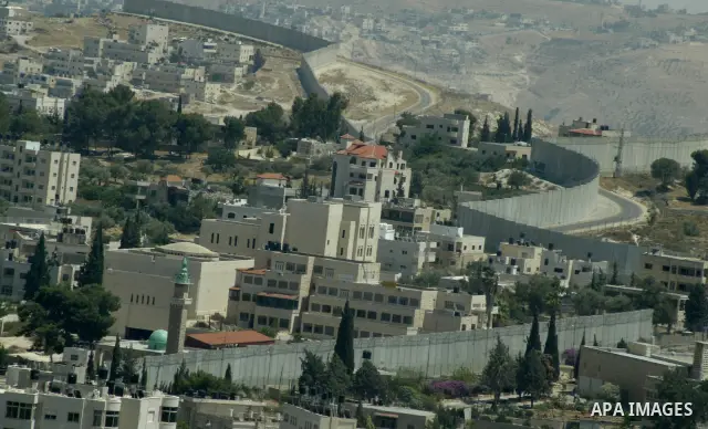 A view for a part of Israel's controversial separation barrier in jerusalem town of kubsa on June 19,2011. Israel says the projected 723 kilometres (454 miles) of steel and concrete walls, fences and barbed wire are need...