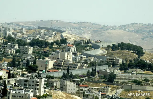 A view for a part of Israel's controversial separation barrier in jerusalem town of kubsa on June 19,2011. Israel says the projected 723 kilometres (454 miles) of steel and concrete walls, fences and barbed wire are need...