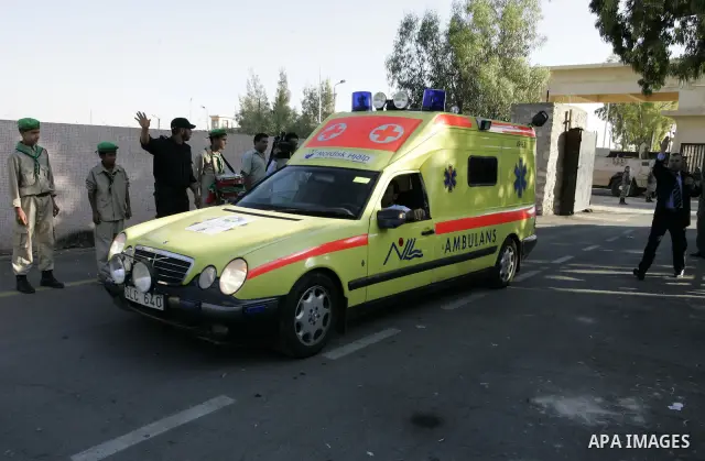 A convoy of "Miles of Smiles 3" carrying medical aid to Gaza crosses the Rafah crossing into the southern Gaza Strip from Egypt on June 19, 2011. The convoy, carrying medical aid for the impoverished Palestinian territor...
