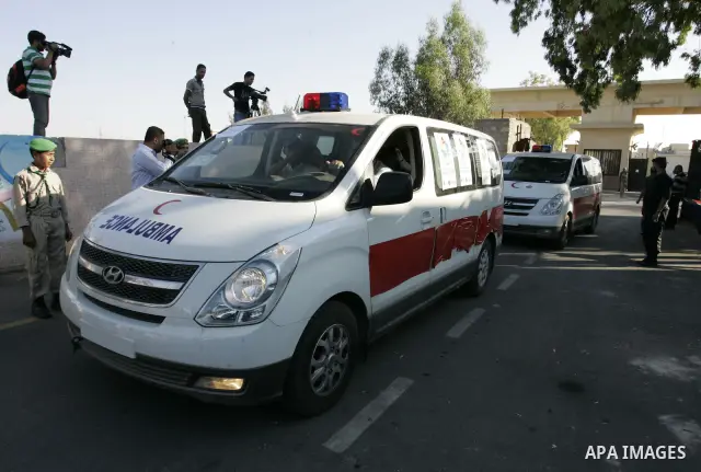 A convoy of "Miles of Smiles 3" carrying medical aid to Gaza crosses the Rafah crossing into the southern Gaza Strip from Egypt on June 19, 2011. The convoy, carrying medical aid for the impoverished Palestinian territor...